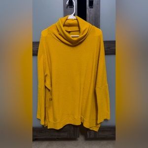 Baggy, thermal,  cowl neck, long sleeved golden shirt.